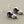 Load image into Gallery viewer, Pair of earrings with amethysts and pearls on a gray background
