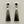 Load image into Gallery viewer, Pair of silver earrings with greenstone pendants on a gray background

