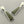 Load image into Gallery viewer, Pair of silver earrings with green stone on a gray background
