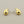 Load image into Gallery viewer, A pair of polished gold crescent moon stud earrings with silver post backs, displayed on a textured dark gray background.
