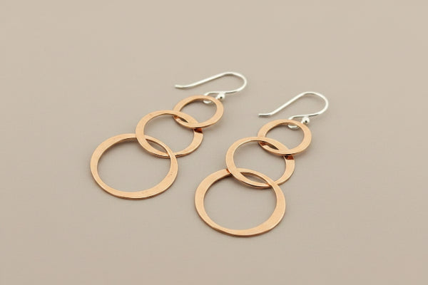 3 flattened copper hoop drop earrings