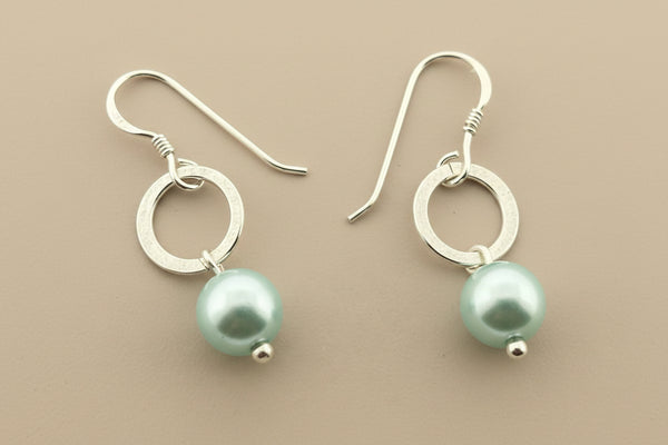Silver circle and pearl drop earring