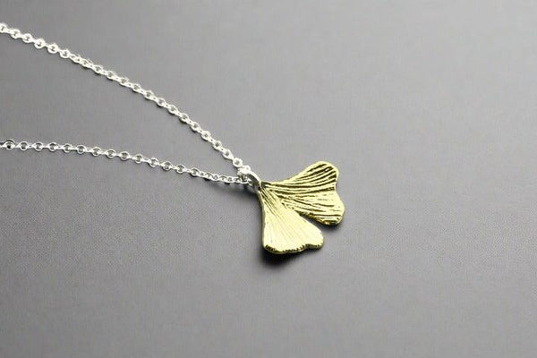 Brass ginkgo leaf pendant on silver necklace - Makers & Providers