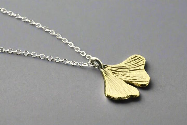 Brass ginkgo leaf pendant on silver necklace - Makers & Providers