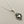Load image into Gallery viewer, Silver necklace with a heart-shaped pendant on a gray background
