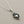 Load image into Gallery viewer, Silver necklace with a heart-shaped pendant on a gray background
