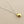 Load image into Gallery viewer, Gold pendant necklace on a gray background
