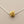Load image into Gallery viewer, Gold nugget pendant on a silver chain against a gray background
