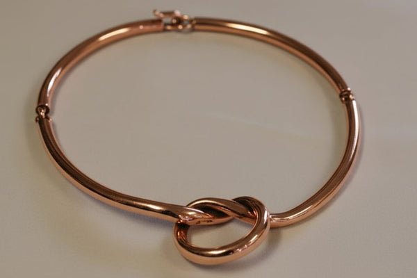 Copper tubular torque with eternity knot