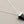 Load image into Gallery viewer, Necklace with a black pyramid pendant on a gray background
