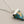 Load image into Gallery viewer, Turquoise pendant necklace on a dark gray background

