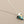 Load image into Gallery viewer, Necklace with a turquoise pendant on a gray background
