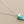 Load image into Gallery viewer, Turquoise cone pendant necklace on a gray background
