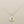 Load image into Gallery viewer, Silver pendant with a yellow gemstone on a gray background
