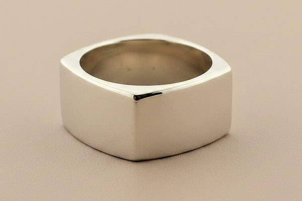 Silver ring on a dark gray background