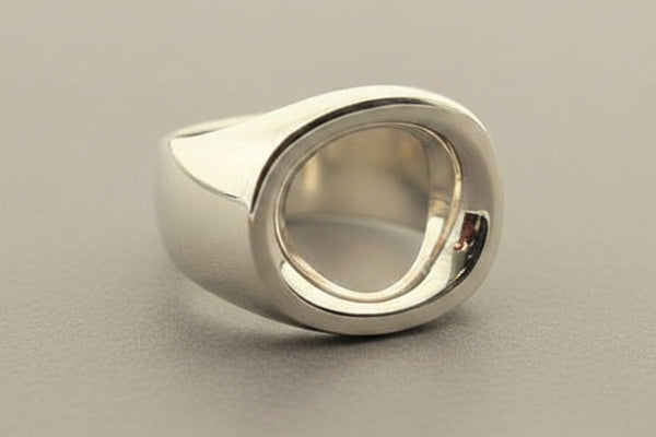 Silver ring on a gray background