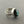 Load image into Gallery viewer, Silver ring with a green gemstone on a gray background
