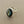 Load image into Gallery viewer, Silver ring with a dark green gemstone on a gray background
