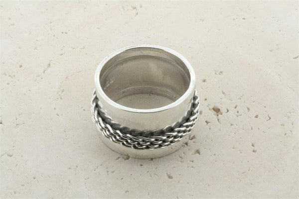 Concave band w woven spinner ring - Makers & Providers