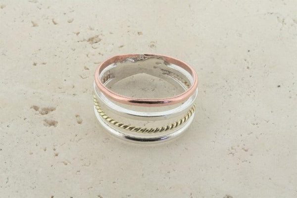 copper, silver & brass ring - Makers & Providers