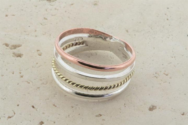 copper, silver & brass ring - Makers & Providers