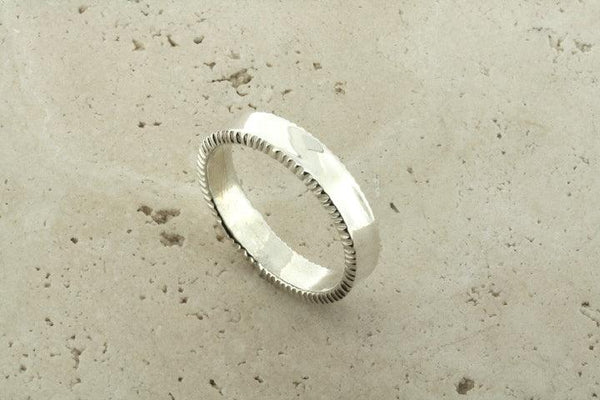 silver band with grooved edge