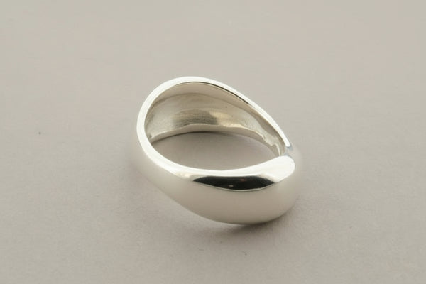 Silver ring on a gray background