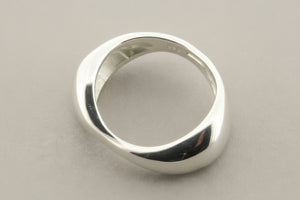 Silver ring on a gray background