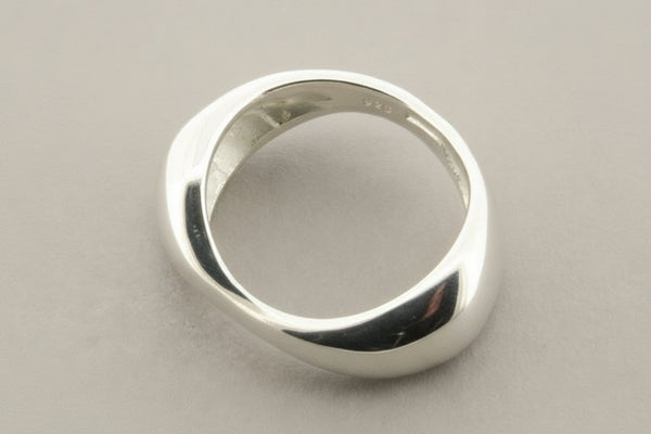 Silver ring on a gray background