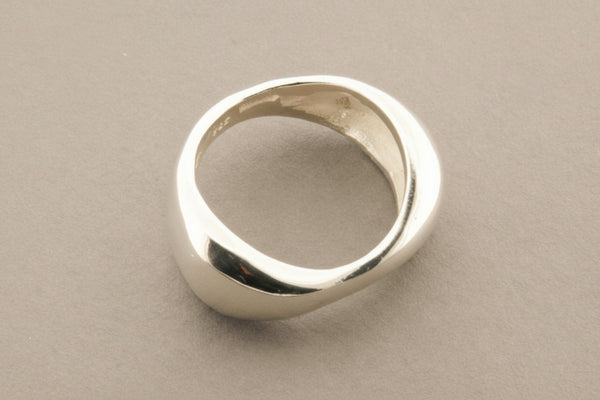 Silver ring on a gray background