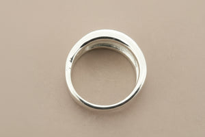 Silver ring on a gray background