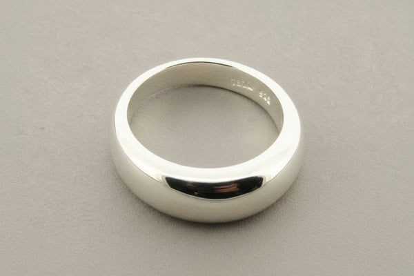 Silver ring on a gray background