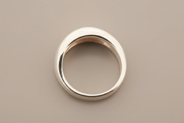 Silver ring on a gray background