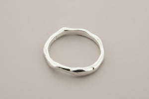 Silver ring on a gray background