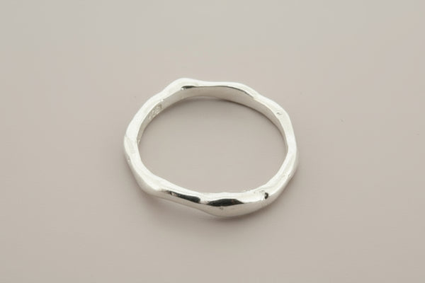Silver ring on a gray background