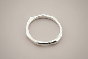 Silver ring on a gray background