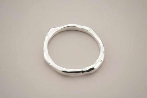 Silver ring on a gray background