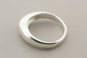 Silver ring on a gray background