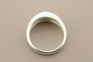 Silver ring on a gray background