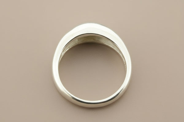 Silver ring on a gray background