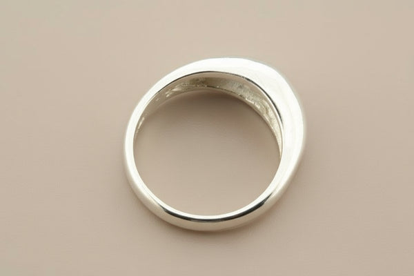 Silver ring on a gray background