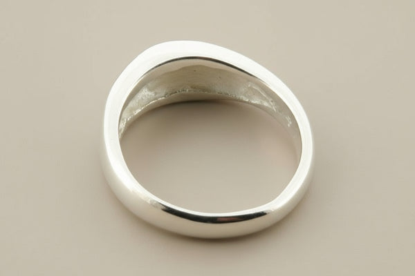 Silver ring on a gray background