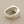 Load image into Gallery viewer, Silver ring with a large diamond on a gray background
