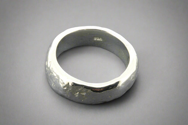 Silver ring on a gray background