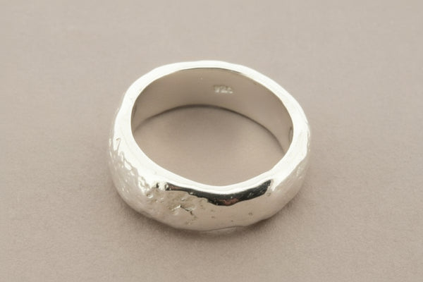 Silver ring on a gray background