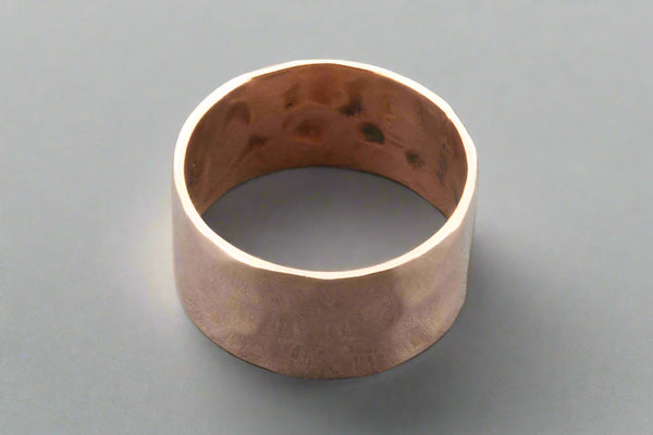 Copper ring on a gray background