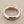 Load image into Gallery viewer, Rose gold ring on a gray background
