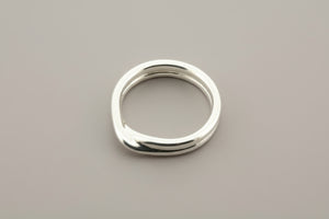 Silver ring on a gray background