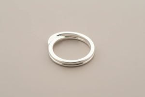 Silver ring on a gray background