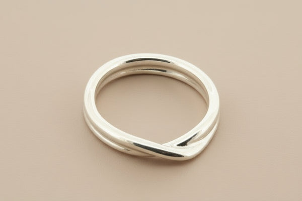 Silver ring on a gray background